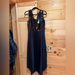 Elegant Black Sequin Dress tank style with pleated skirt. Zip back